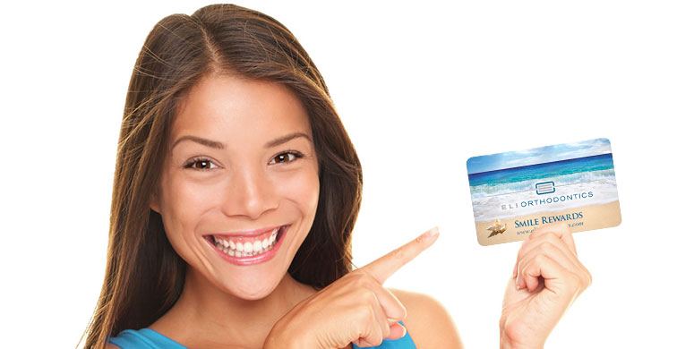 woman holding rewards card